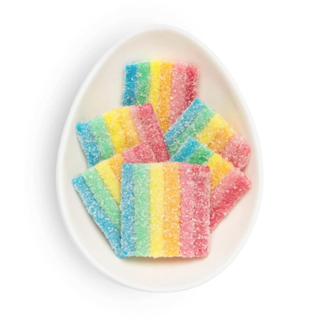 Sugarfina Sour Rainbows gummy candy in white oval dish to show detail.