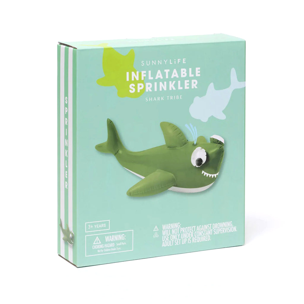 Sunnylife Shark Tribe sage green shark shaped inflatable sprinkler with 3d googly eyes in box packaging.
