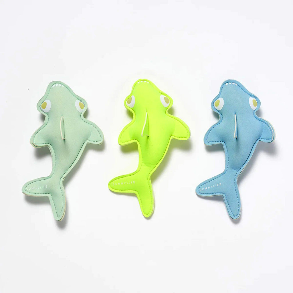 Set of 3 Sunnylife Shark Tribe shark-shaped weighted dive buddies pool toys in green, neon yellow and blue.