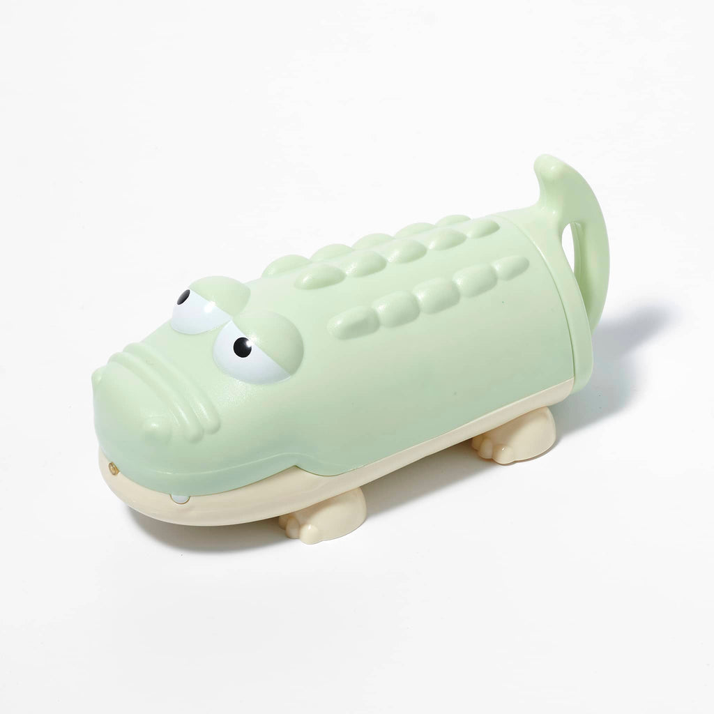 Sunnylife Crocodile Water Squirter in pastel green, overhead front and side view.