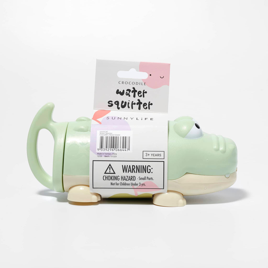Sunnylife Crocodile Water Squirter in pastel green with belly band packaging, side view.