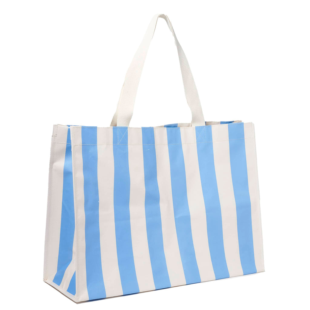 Sunnylife Carryall Beach Bag in Le Weekend Mid Blue and Cream Stripe, front angle view with white webbed handles up.