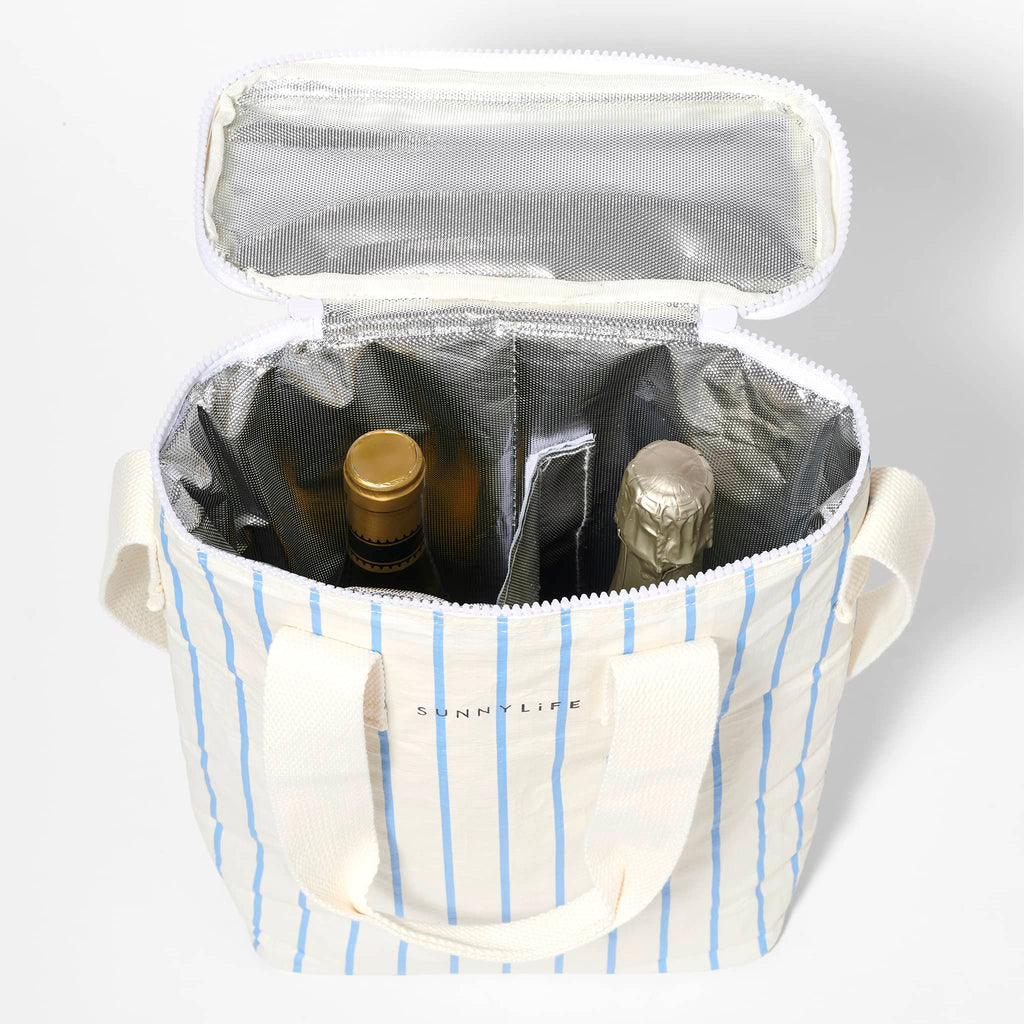 Sunnylife Insulated Drinks Cooler Bag in Le Weekend in white with blue pin stripes, overhead view, lid open, showing silver insulated lining, divider and 2 bottles inside.