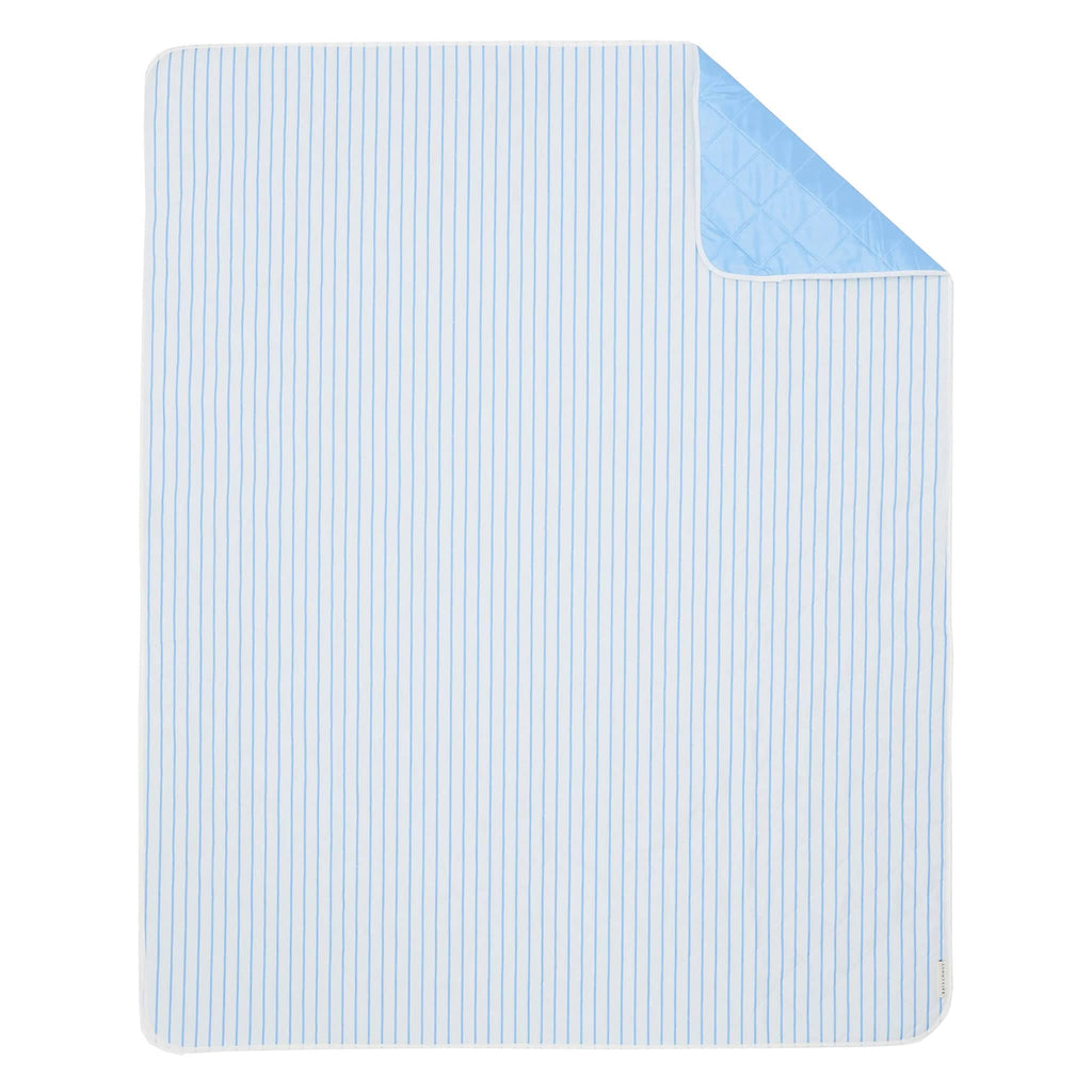 Sunnylife Beach and Picnic Blanket in Le Weekend, white with blue pinstripes, flat front view with corner flipped back to see solid blue backing.