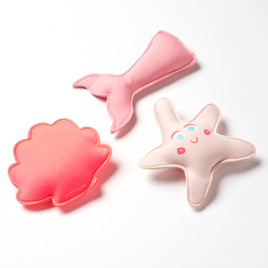 Sunnylife Melody the Mermaid Dive Buddies pool toys set of 3, pink mermaid tail, coral scallop shell and dusty pink starfish, side view.
