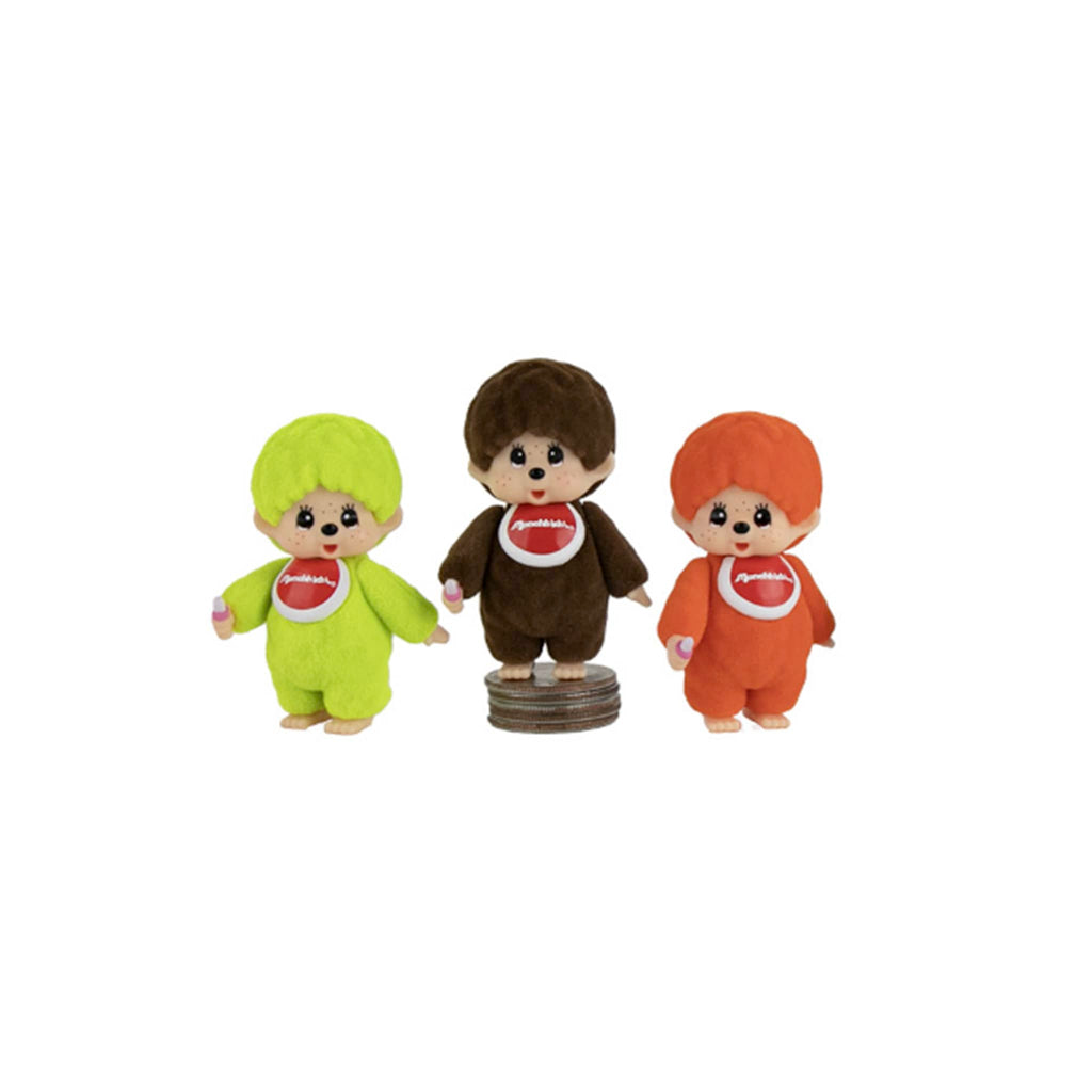 World's Smallest Monchhihi figurines in green, brown and orange, on a white background.