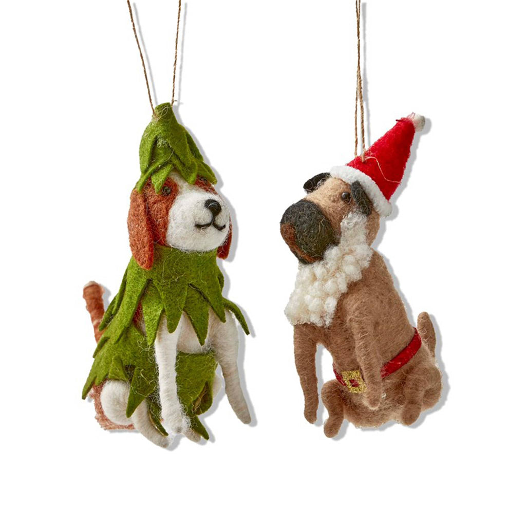 Two dog-shaped felt Christmas ornaments, one in a tree costume and the other in a Santa hat and beard, on a white background.