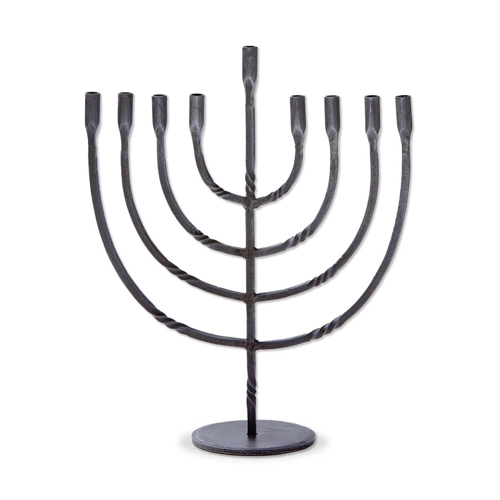 Black iron Menorah with twist design, on a white background.
