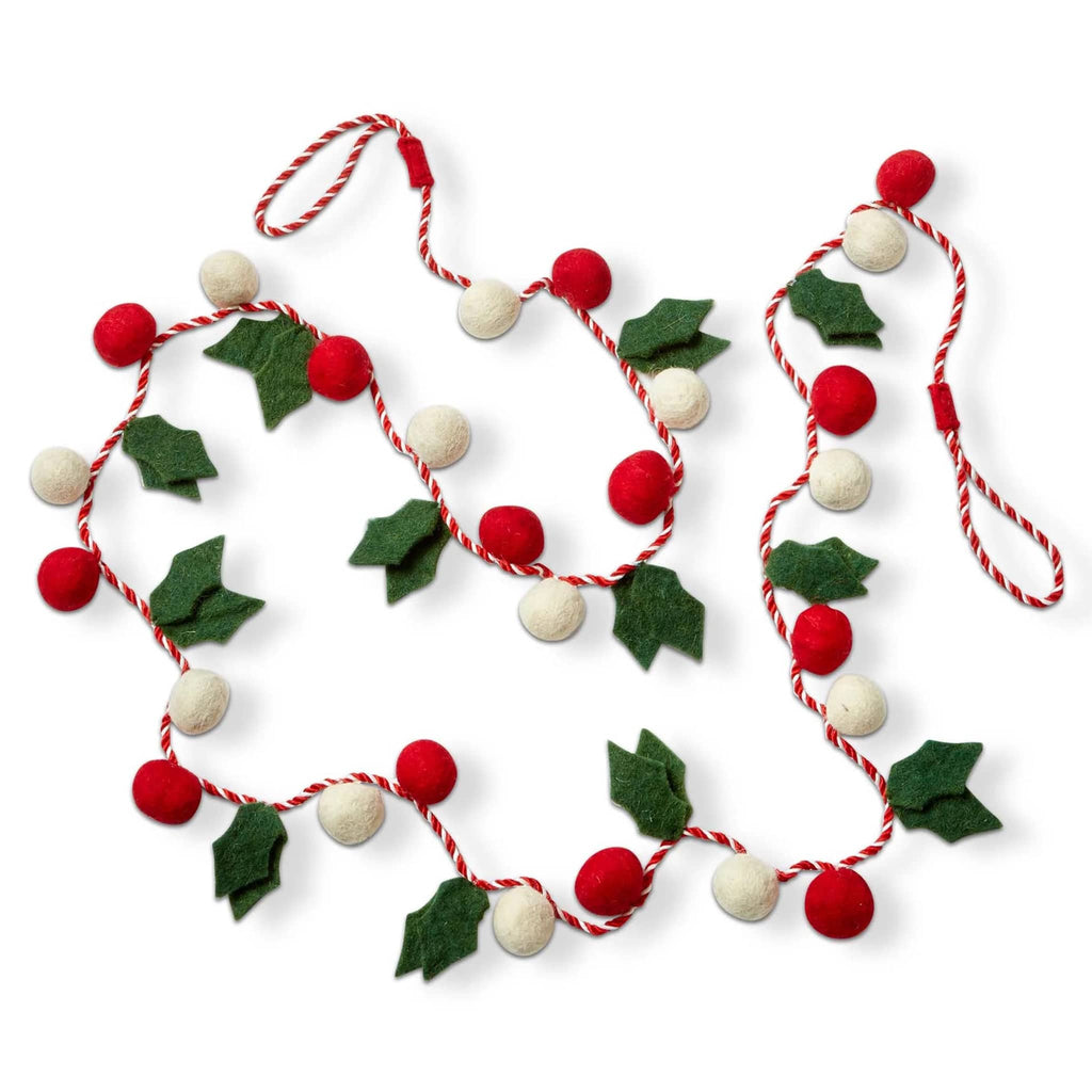 Decorative garland with green felt holly leaves and solid red and white balls with hanging loops at both ends, on a white background.