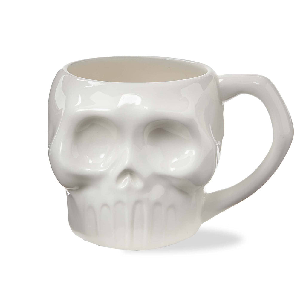 White ceramic skull mug, front view on white background.