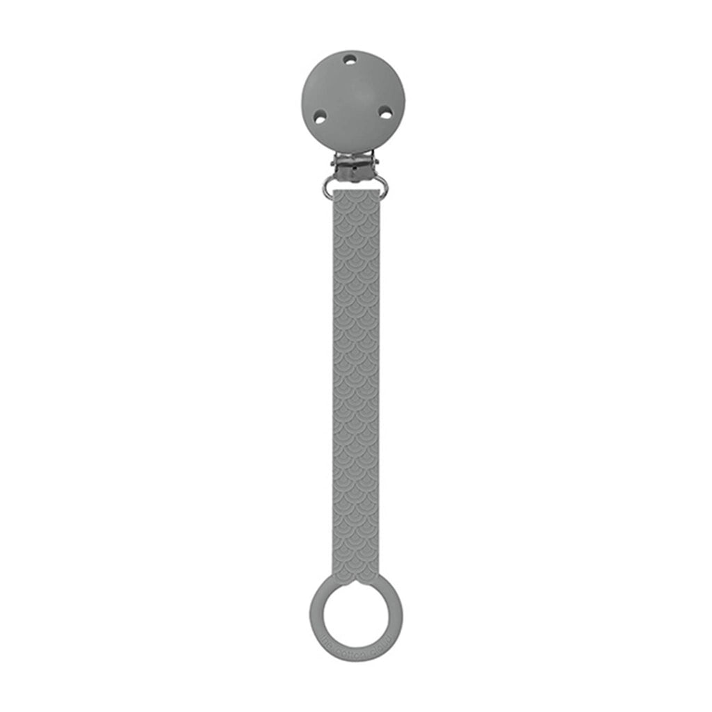 The Cotton Cloud Scallop silicone pacifier holder in graphite gray.