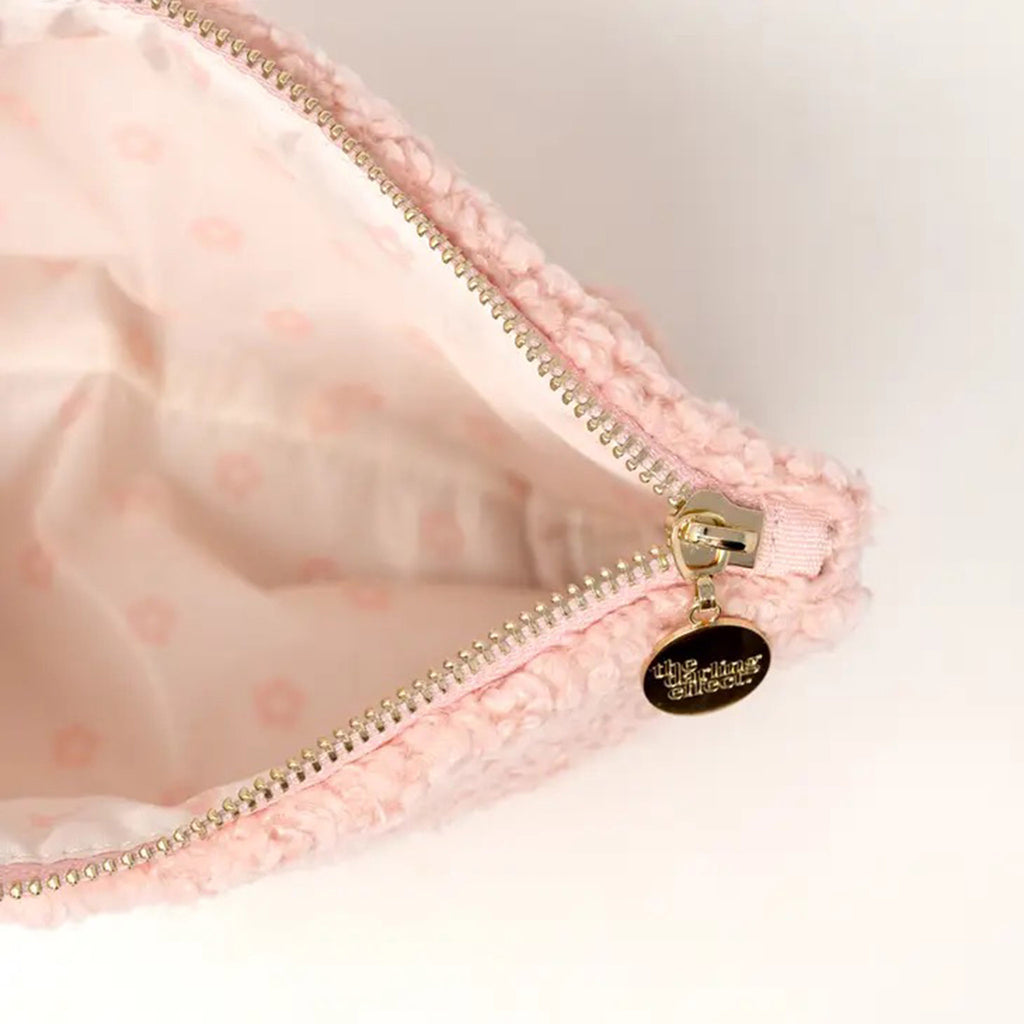 The Darling Effect Blush Pink Teddy Zip Pouch with Stuff in white lettering, detail of gold zipper hardware and floral print interior lining.