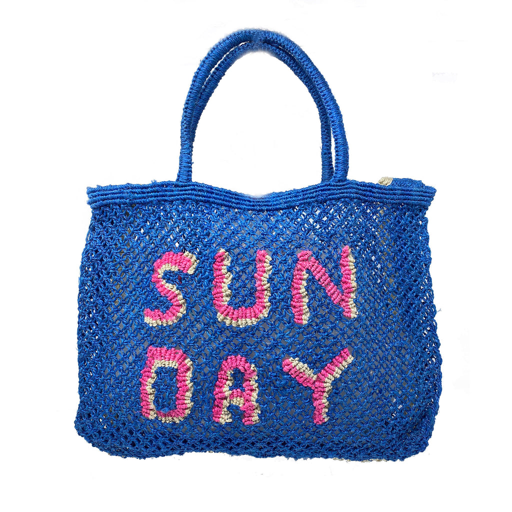 The Jacksons small jute mesh summer tote bag in cobalt blue with "Sun Day" in hot pink letters with natural off-white shadow.