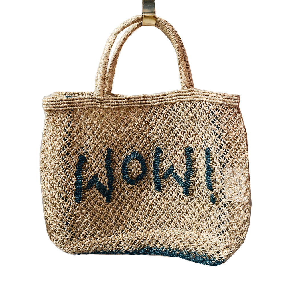 The Jacksons small jute mesh summer tote bag in natural with "Wow!" in ocean blue letters with a khaki shadow.
