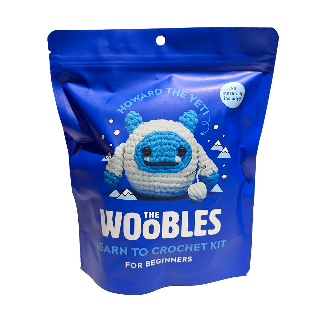 Blue packaging of 'The Woobles' learn to crochet kit with a yeti toy illustration.