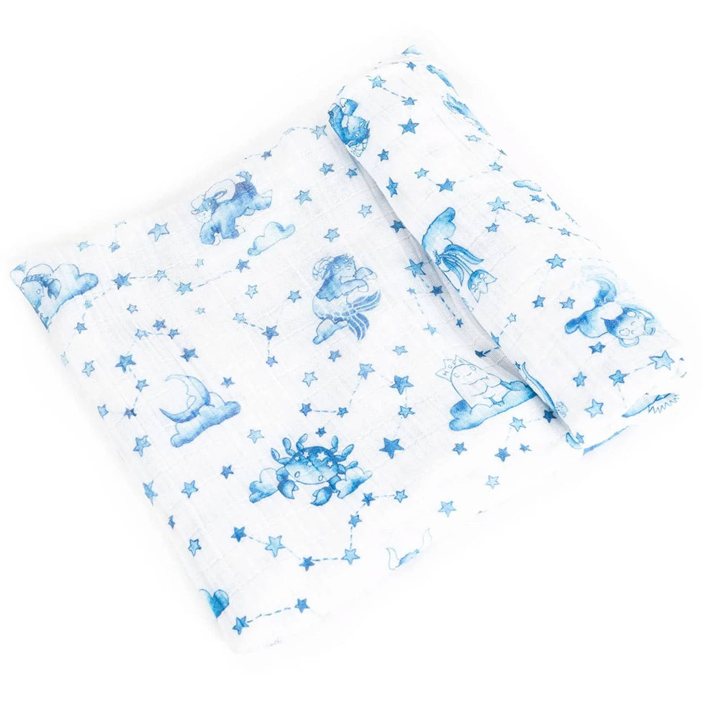 This Feels Nice Solo Stargazer Astrology cotton muslin baby swaddle blanket with blue zodiac sign illustrations on a white backdrop, folded.