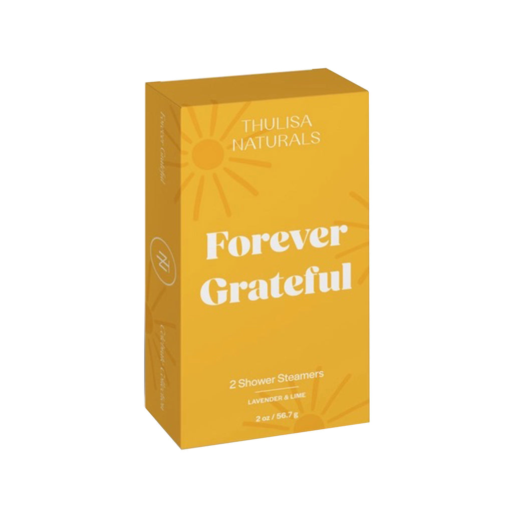 Thulisa Naturals Lavender and Lime Shower Steamers 2 Pack in yellow box with sun illustrations and "Forever Grateful" in white lettering, front angle view.