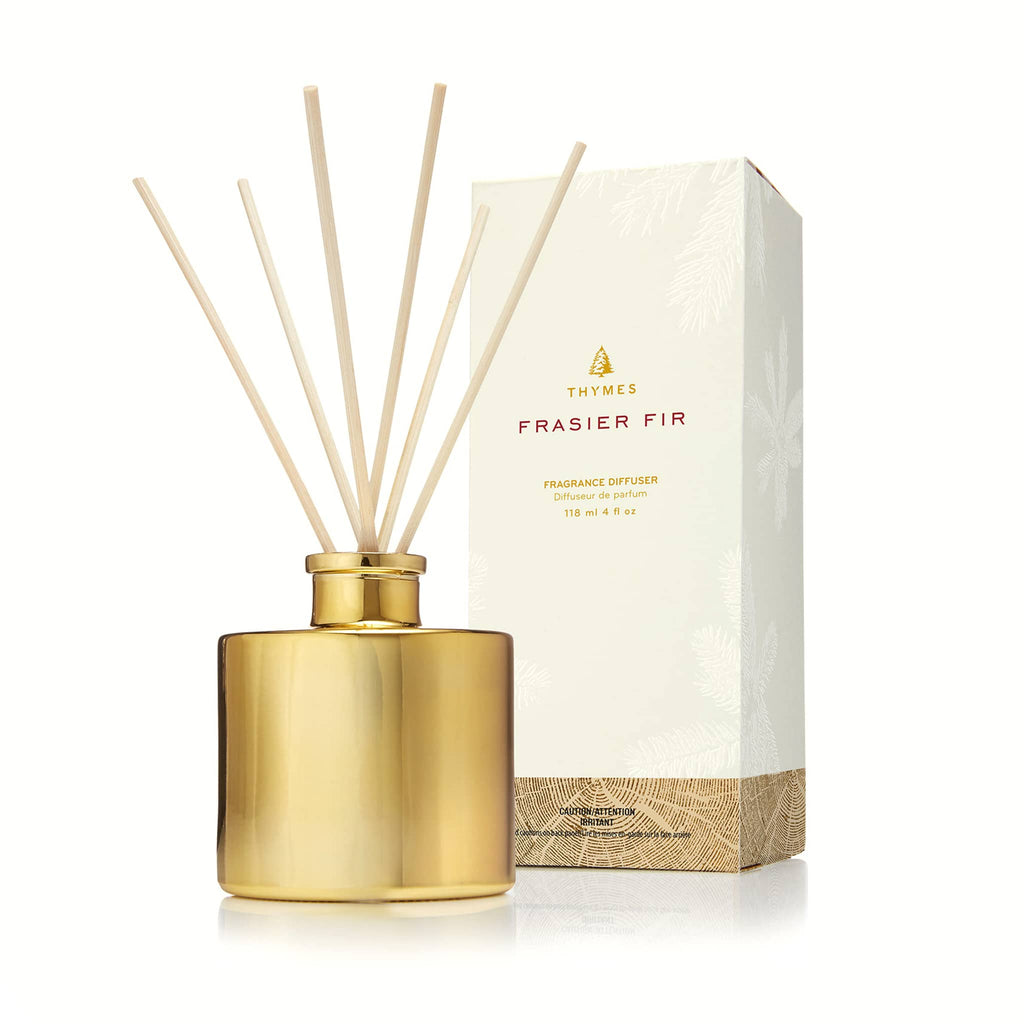 Thymes Frasier Fir Gilded Gold petite reed fragrance diffuser with natural reeds and a white pine needle print gift box.