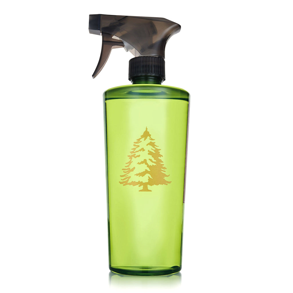 Thymes Frasier Fir scented all-purpose countertop spray cleaner in green bottle with gold tree graphic and black spray nozzle.