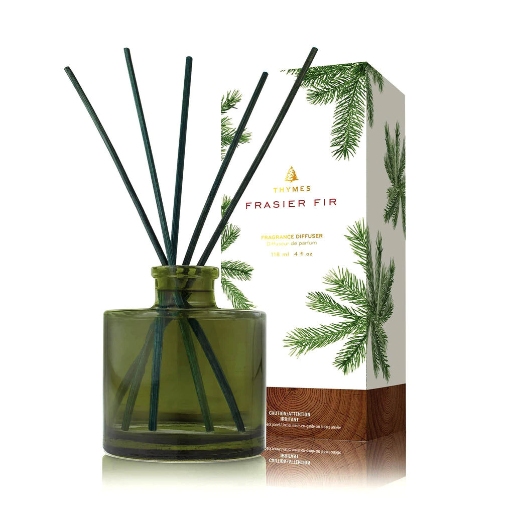 Thymes Frasier Fir Heritage dark green petite reed fragrance diffuser with green reeds and a pine needle print gift box.