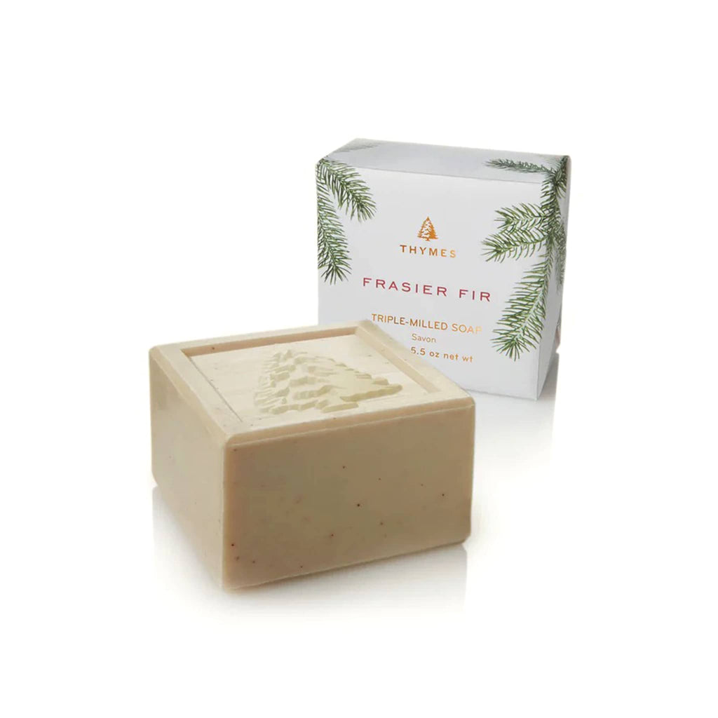 Bar of soap with a Thymes Frasier Fir branded box on a white background.