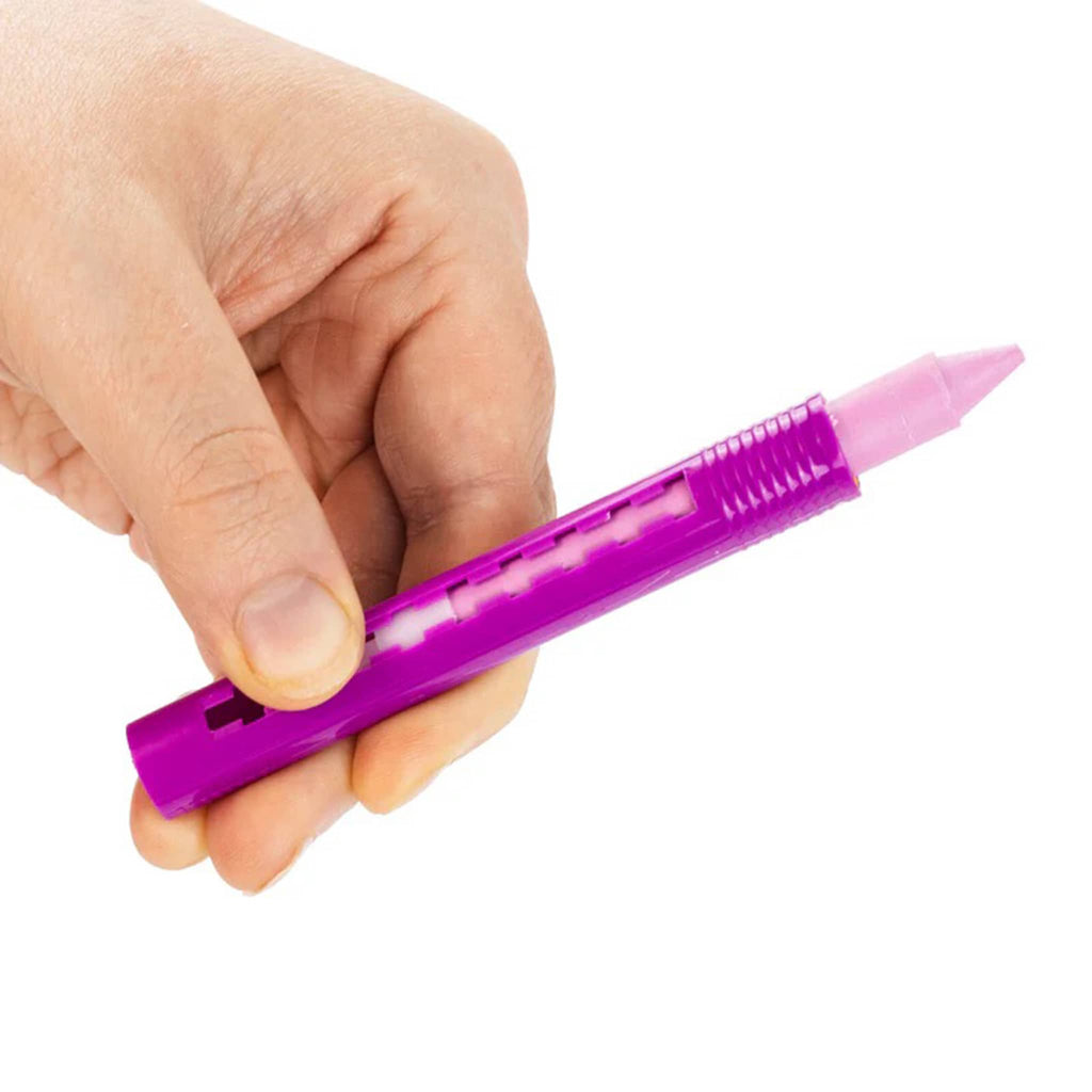 Hand holding a purple bath crayon on a white background.