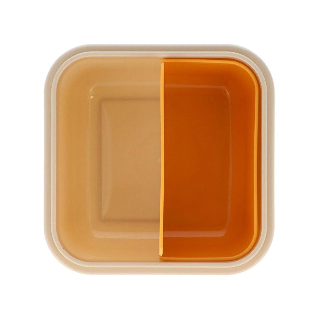 Tan square kids lunch box, overhead view showing orange insert, on a white background.