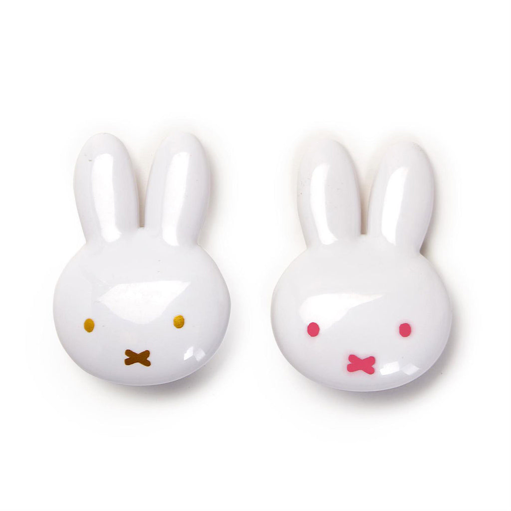 Two's Company Some Bunny Loves Me vanilla or strawberry scented shimmer lip gloss in white plastic bunny head container.