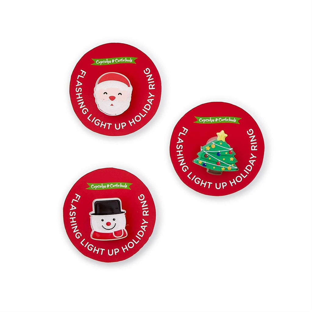 Two's Company Flashing Light Up Holiday plastic novelty adjustable ring in 3 styles on red card circle packaging.