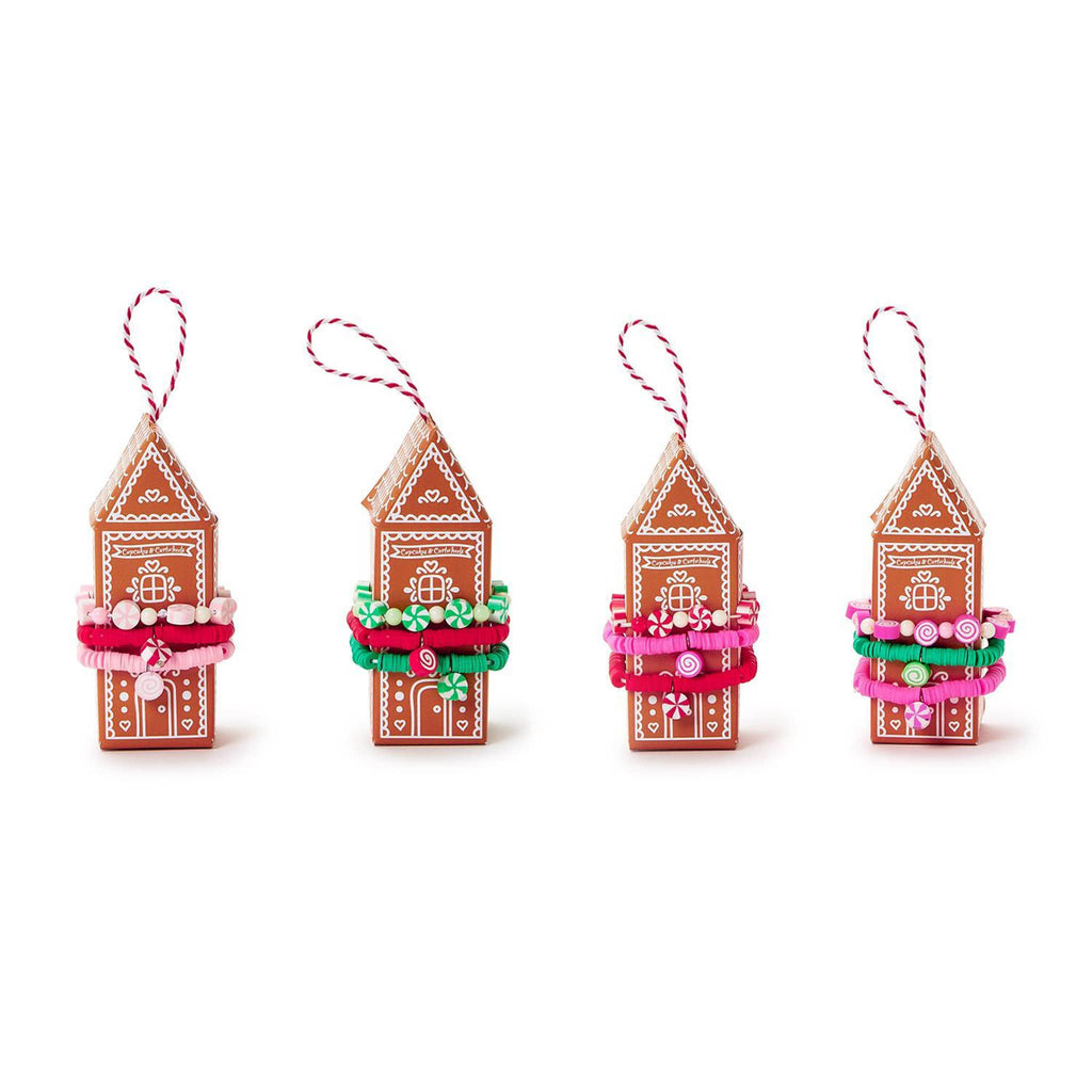 Two's Company Peppermint Candy kids elastic bracelets, set of 3 on gingerbread house packaging in 4 style assortments.