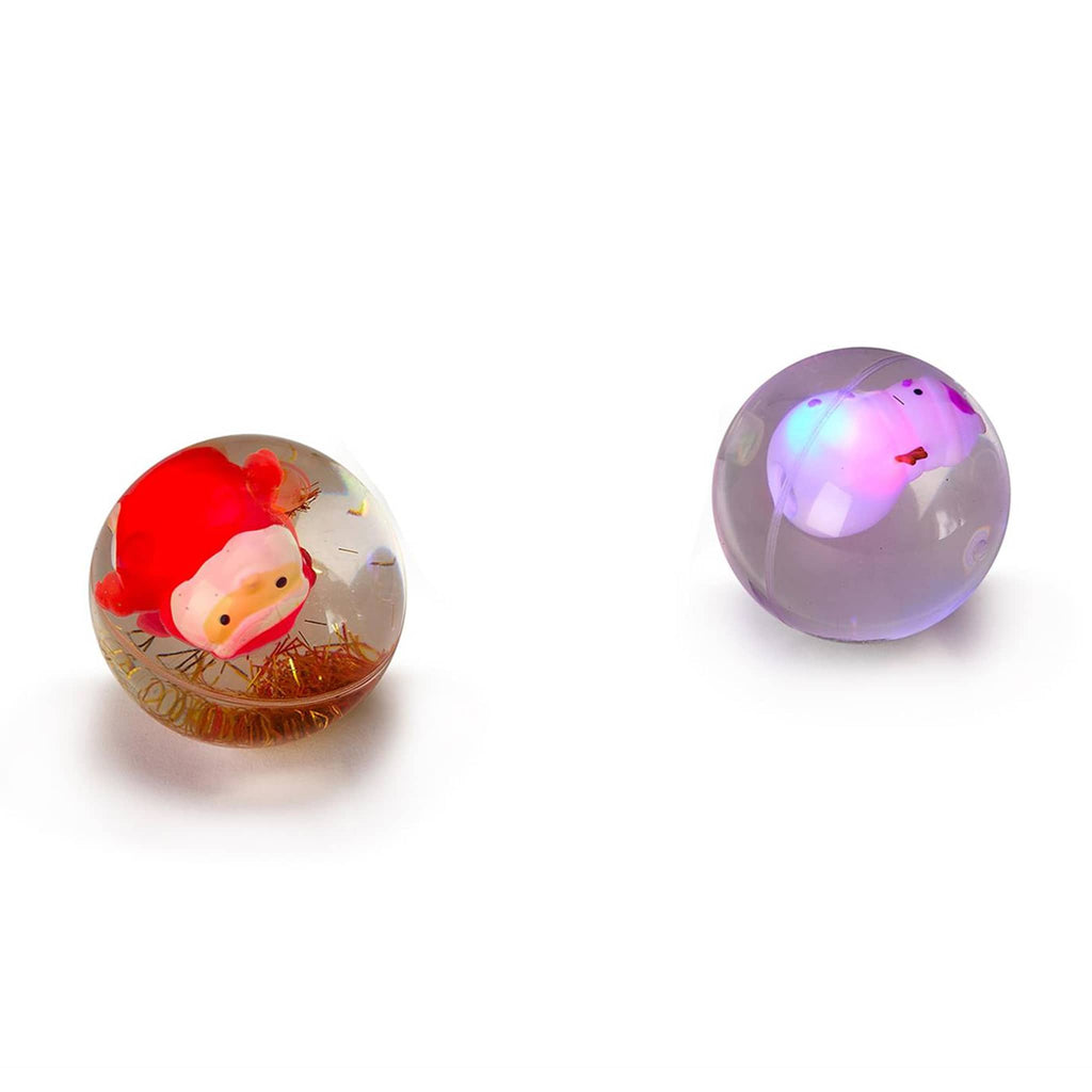 Two's Company LED glitter bouncing ball with santa or snowman light-up figurine inside, lit.