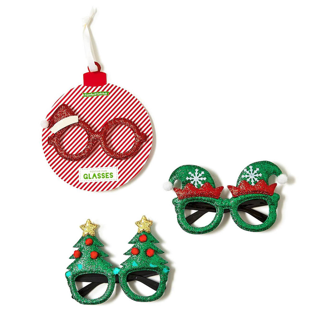 Two's Company Festive Fun glitter holiday novelty glasses in 3 styles on ornament card packaging.