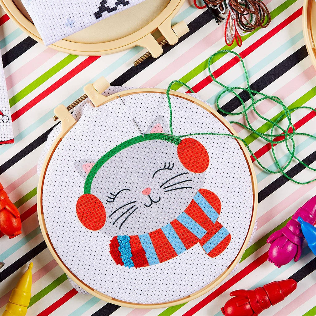 Two's Company Santa's Friends Cross Stitch Kit, cat with earmuffs and scarf kit in progress.