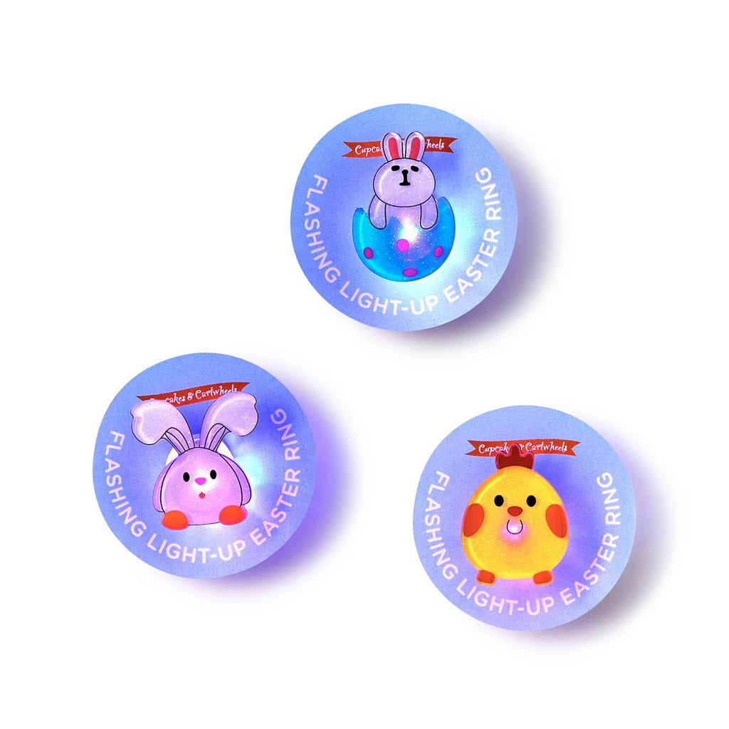 Two's Company Easter Flashing Light-Up Ring in 3 styles on card backing, lit.