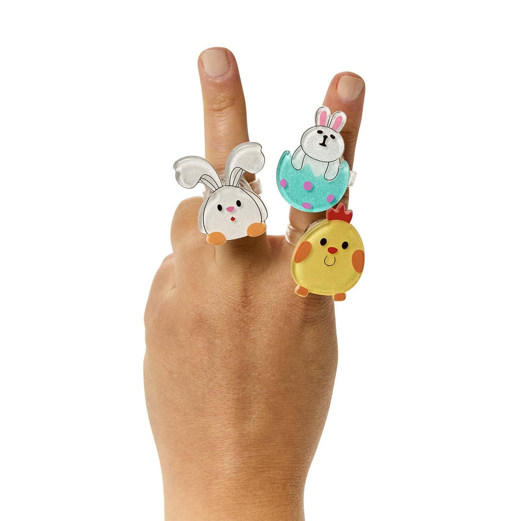 Two's Company Easter Flashing Light-Up Ring in 3 styles on child's fingers.