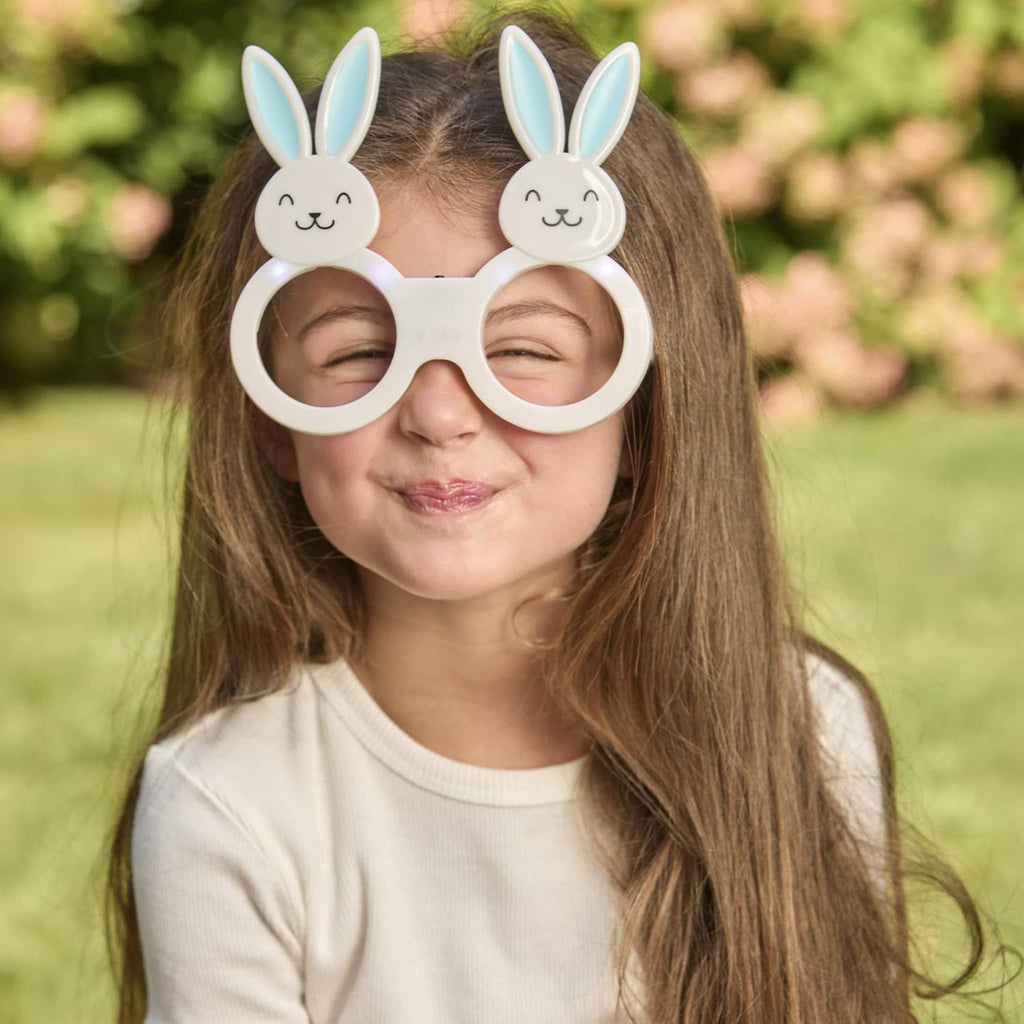 Two's Company Light-Up Bunny Glasses in blue on child's face.