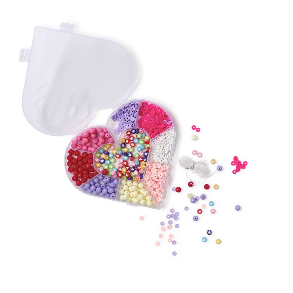 Two's Company Love Beads Bracelet Making Craft Kit in heart-shaped plastic storage container, lid open with stretch cord and some beads in front of it.