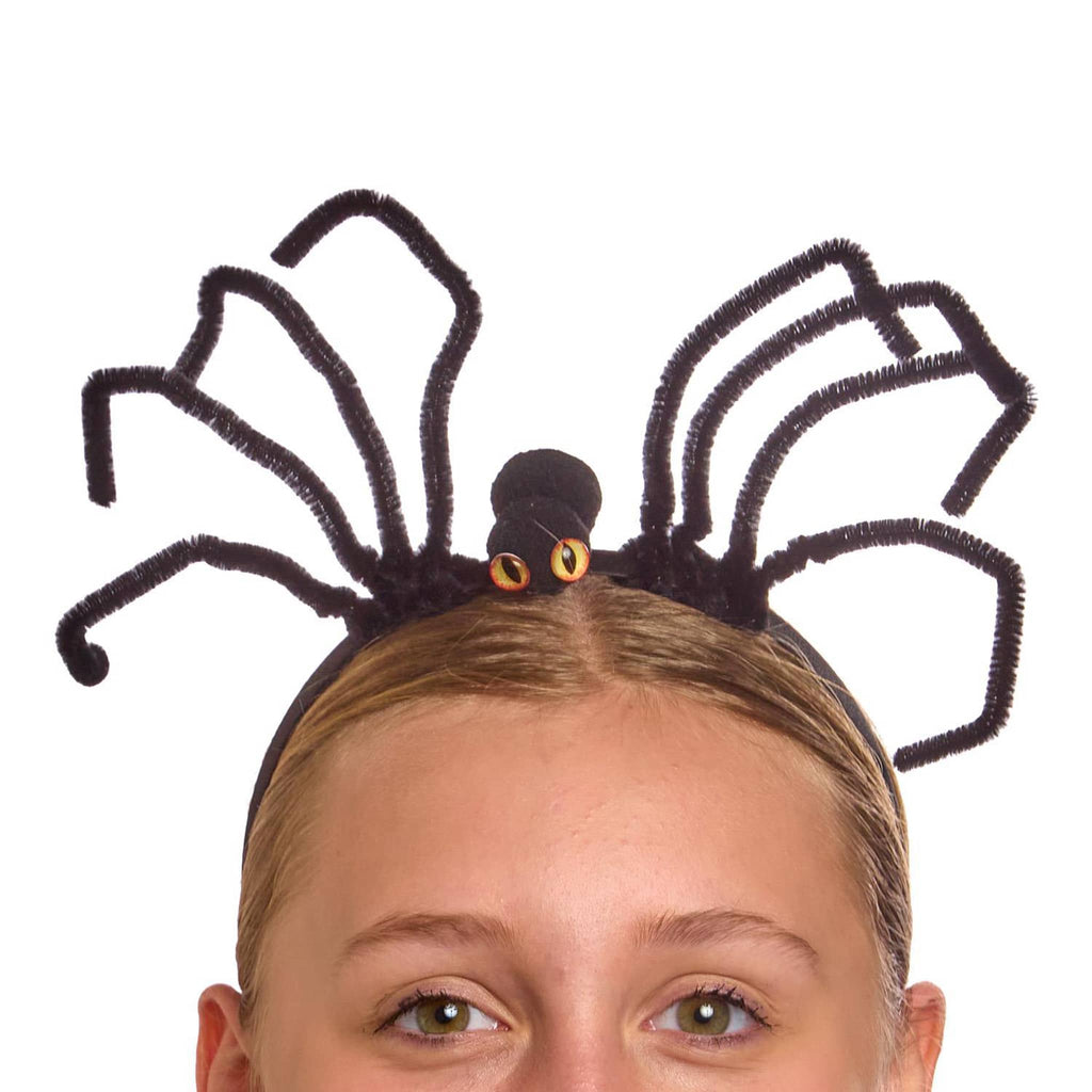 Spider-shaped headband worn by a person on a white background.