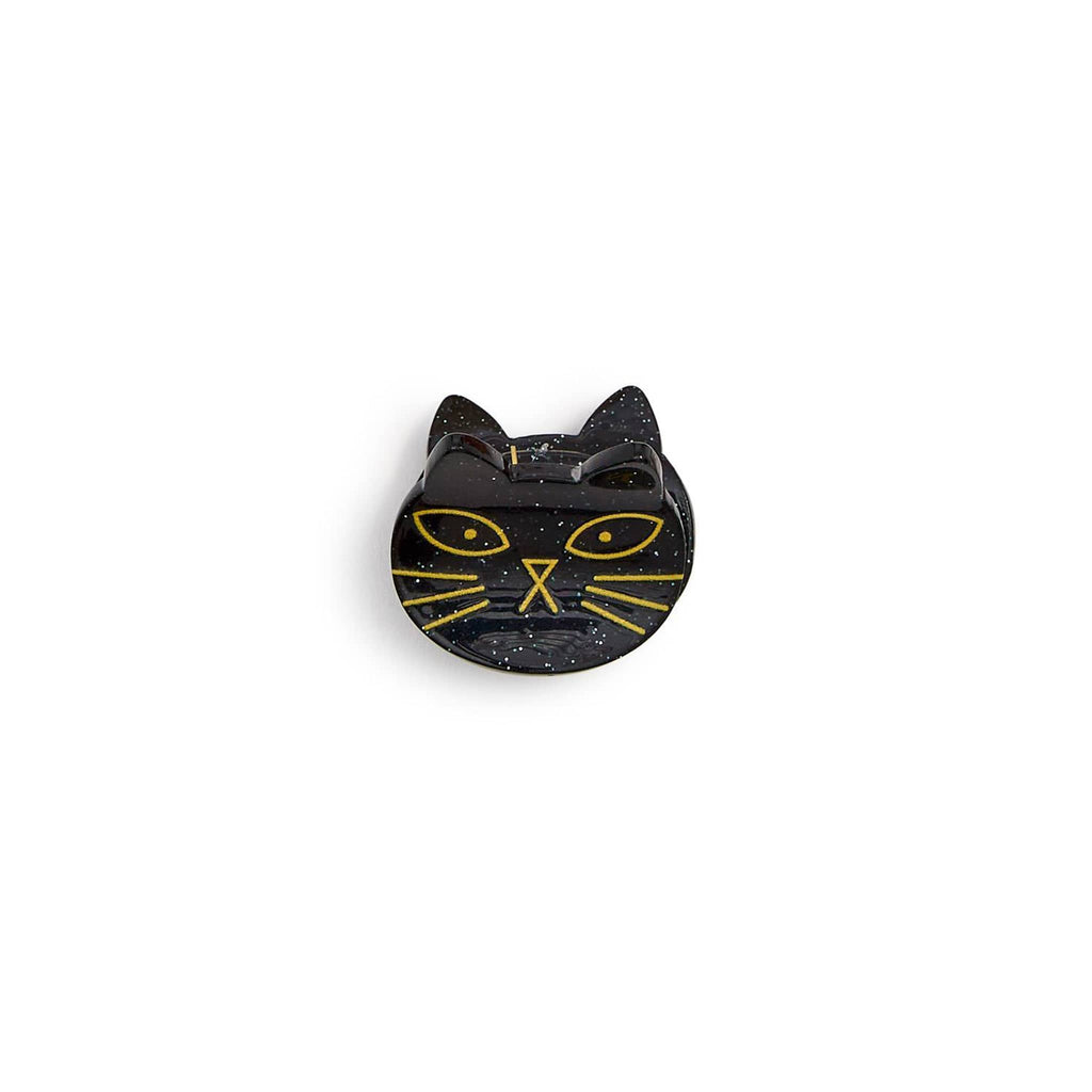 Small plastic black cat hair claw clip on a white background.
