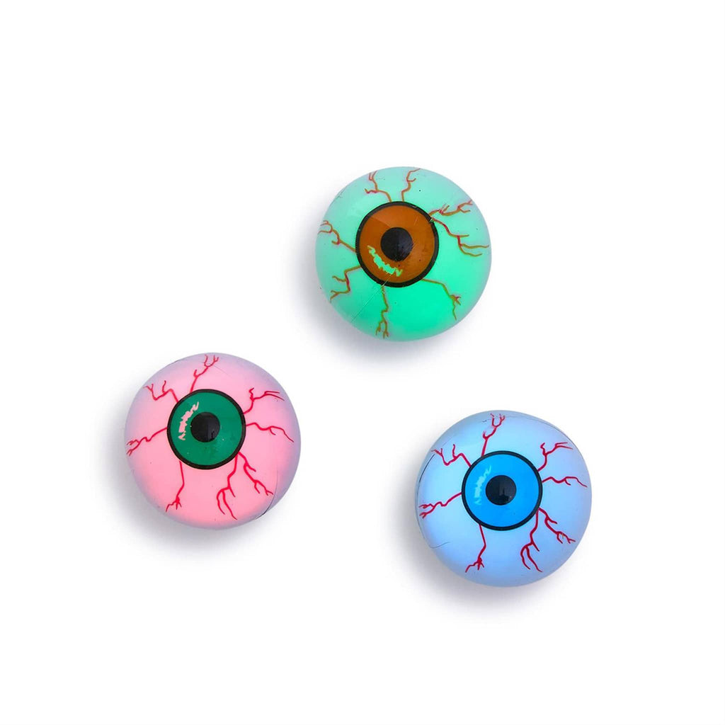 Three toy floating eyeballs with red, green, and blue irises, lit, on a white background.