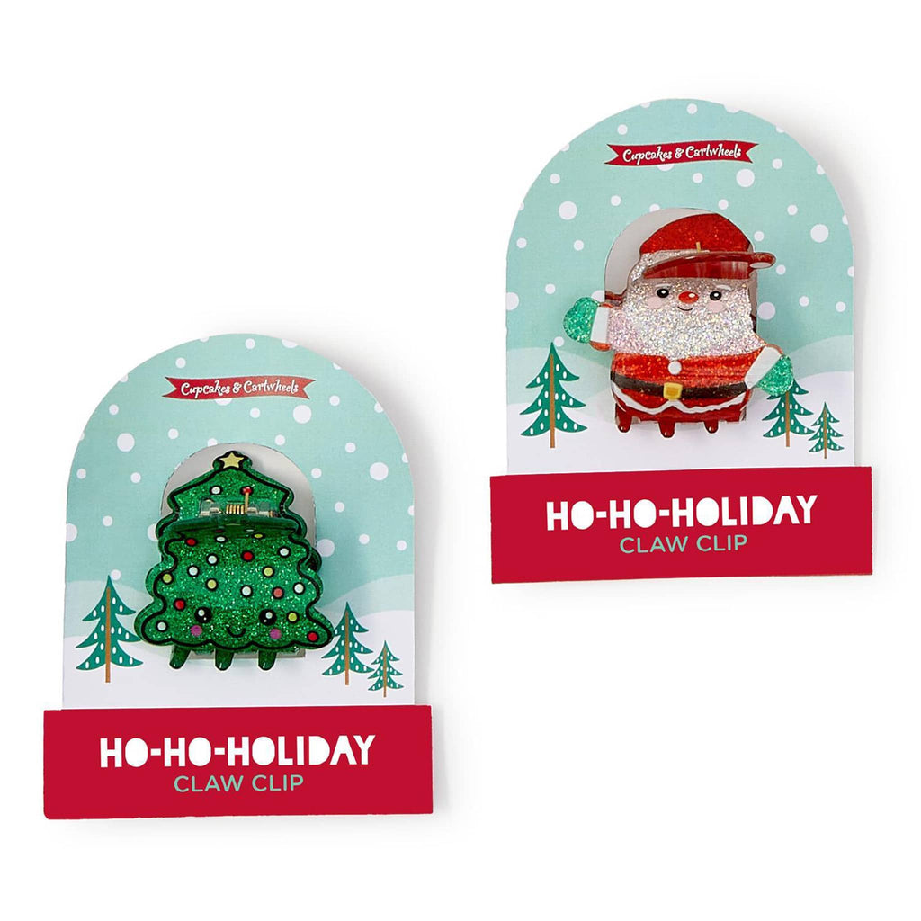 Two Christmas-themed claw clips in packaging on a white background,