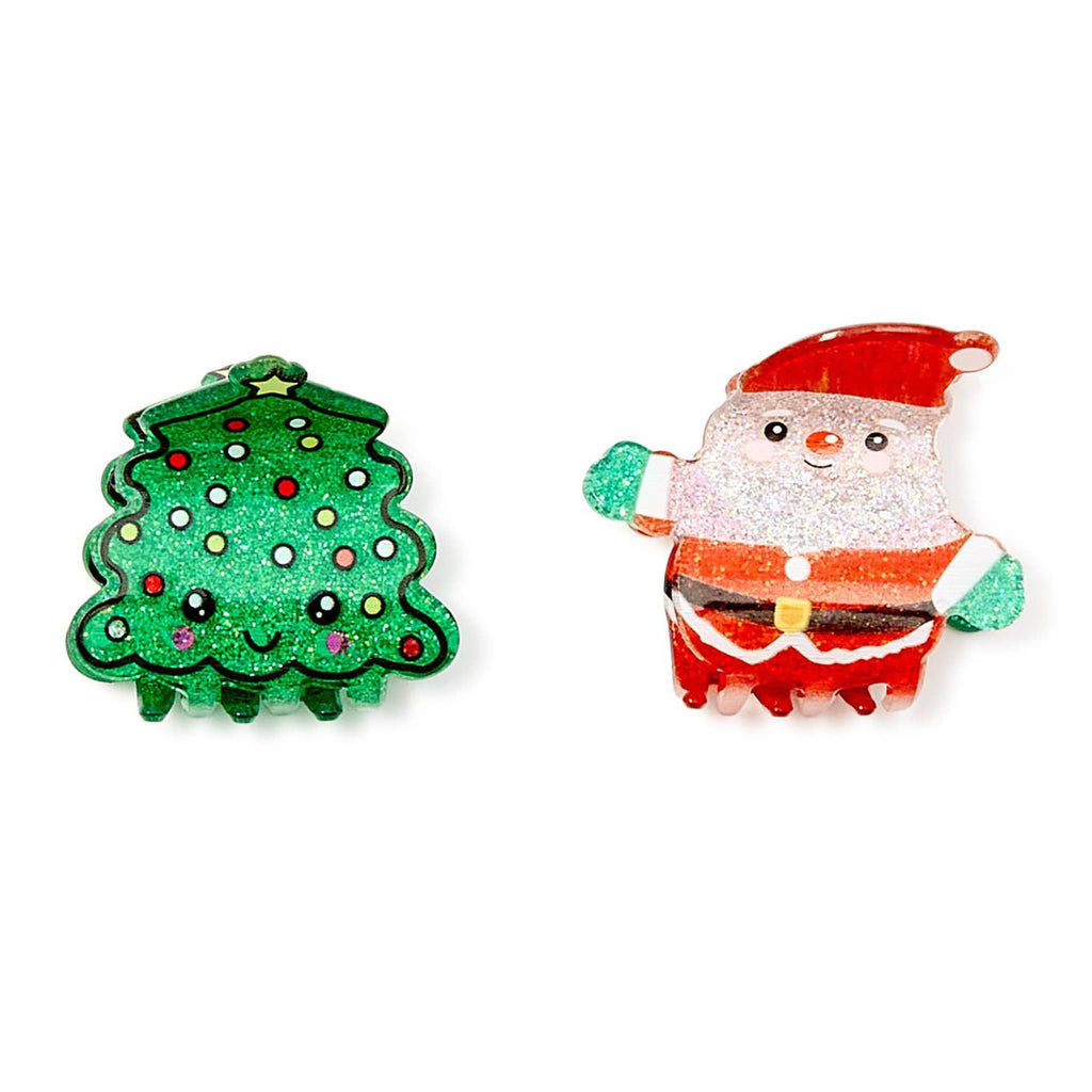Two Christmas-themed hair claw clips, one shaped like a green Christmas tree and the other like a Santa Claus figure, on a white background.