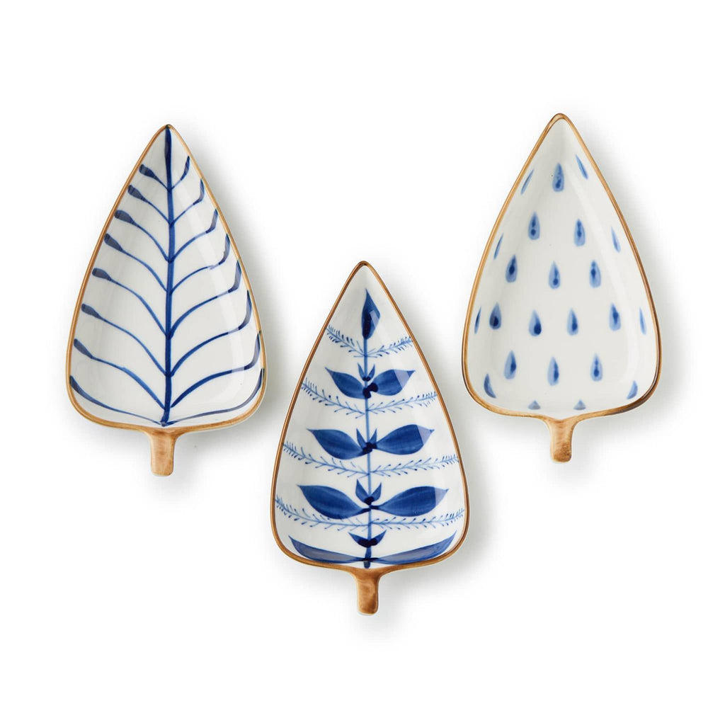Three tree-shaped small ceramic plates with blue patterns on a white background.