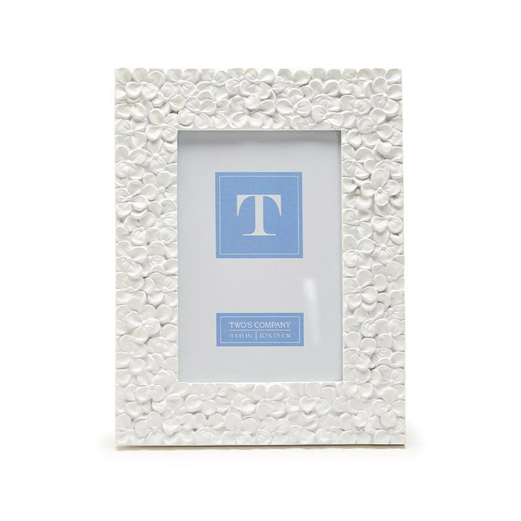 Two's Company 4x6 inch picture frame with white resin hydrangea pattern, front view.