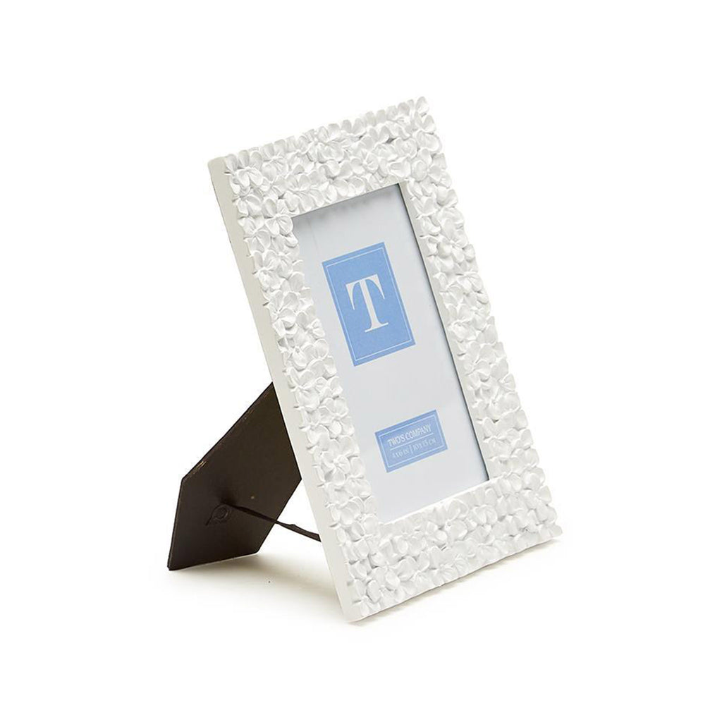 Two's Company 4x6 inch picture frame with white resin hydrangea pattern, side view.