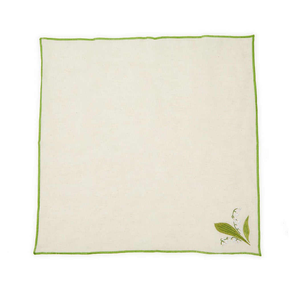 Two's Company Lily of the Valley embroidered cotton chambray napkins with white flowers and green border, flat.