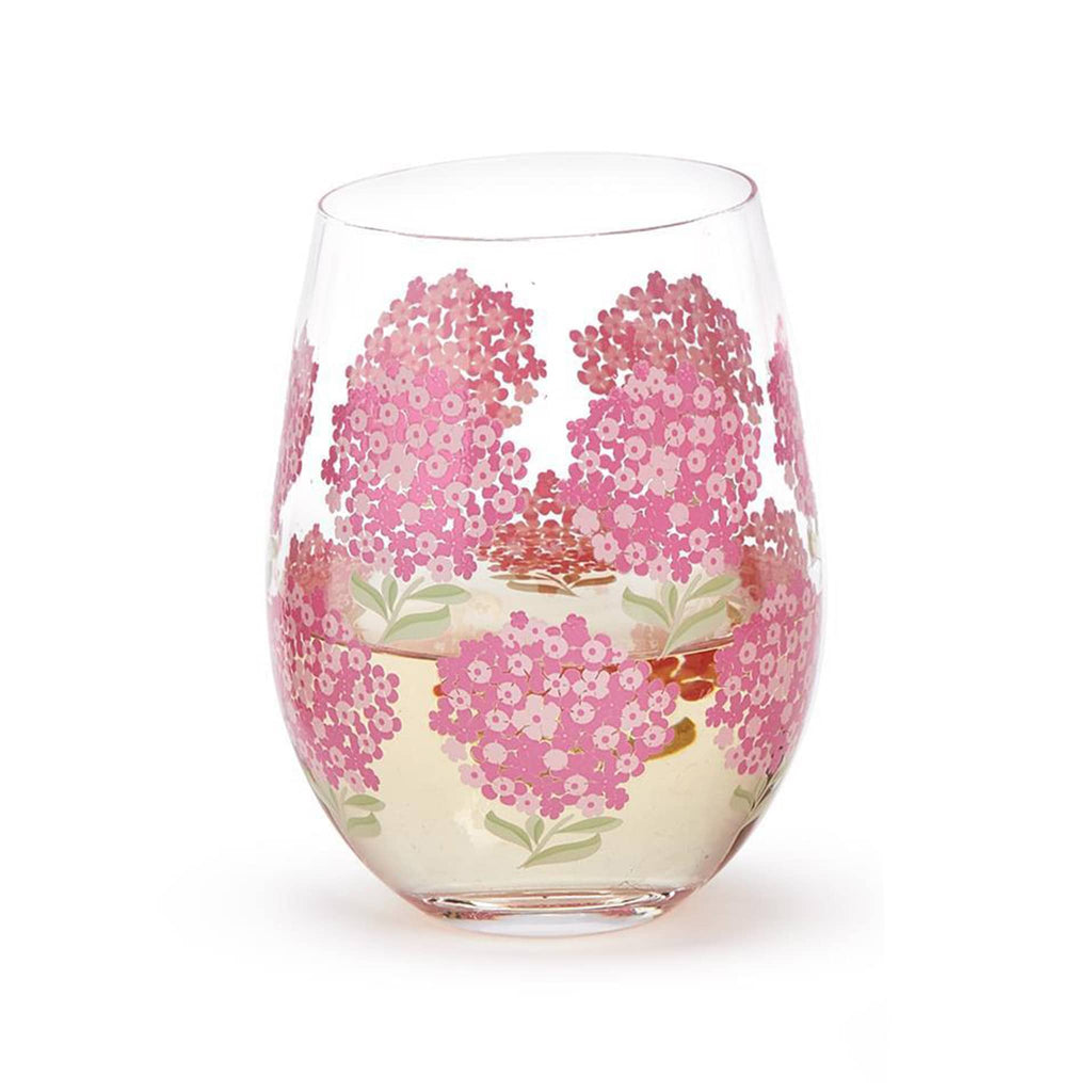 Two's Company Pink Hydrangea stemless wine glass half-filled with white wine.