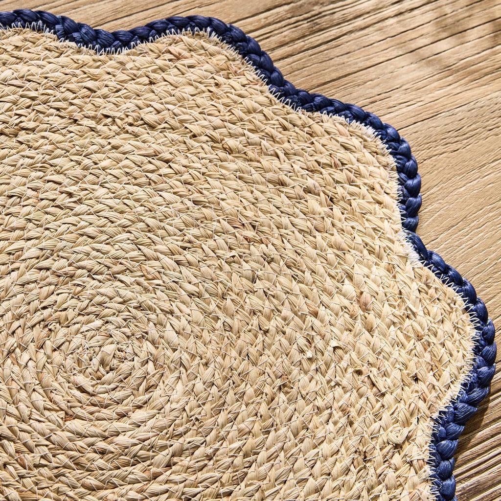 Two's Company Handwoven Seagrass Placemats with navy scalloped edge, detail.
