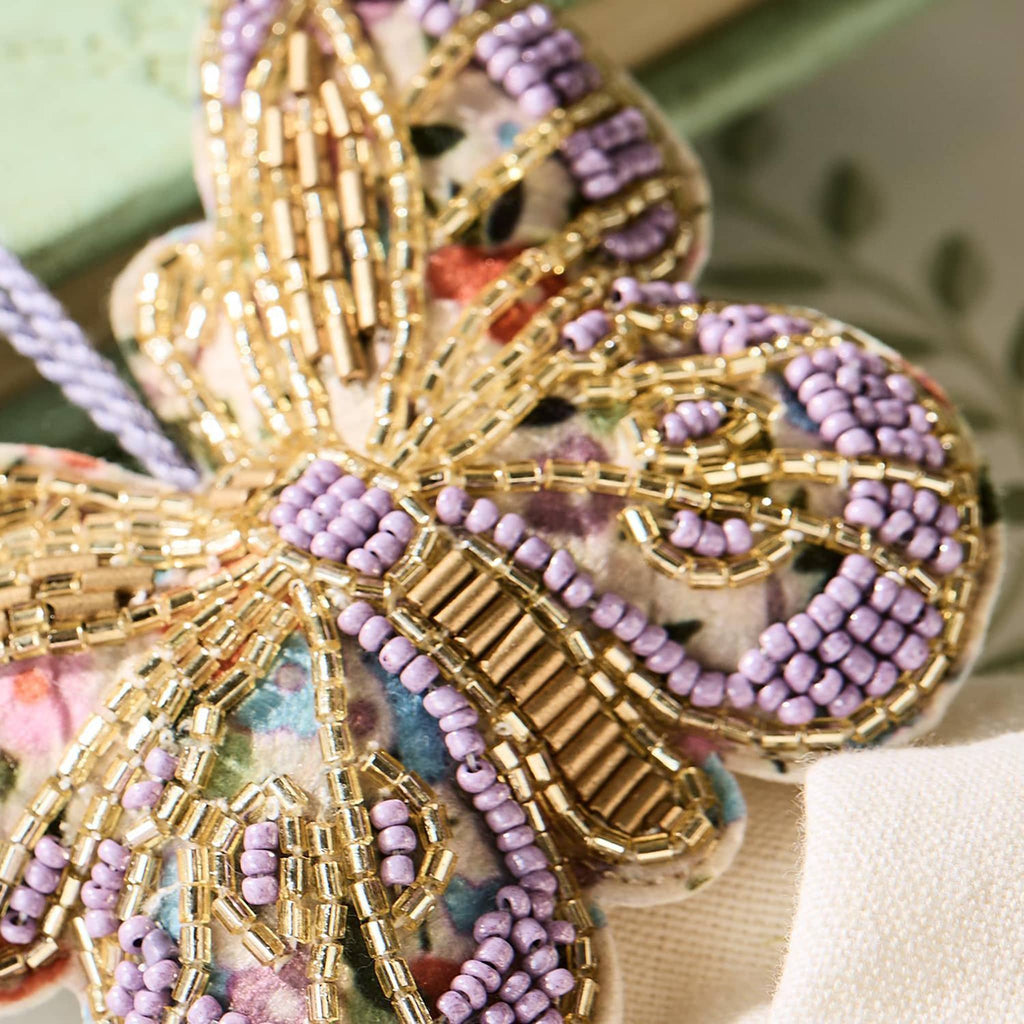 Two's Company Hand-Beaded Butterfly Ornaments in purple, detail.