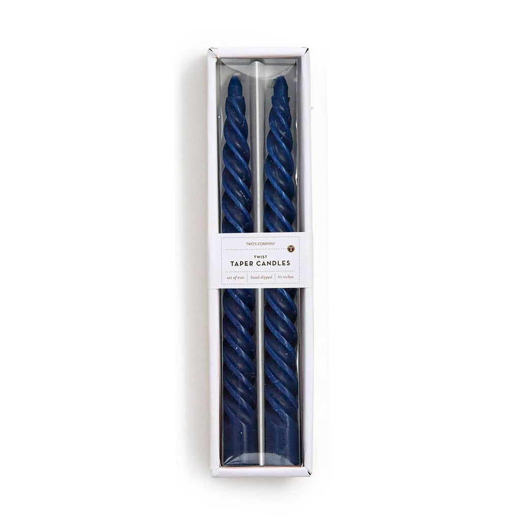 Two blue twisted taper candles in a white box on a white background.